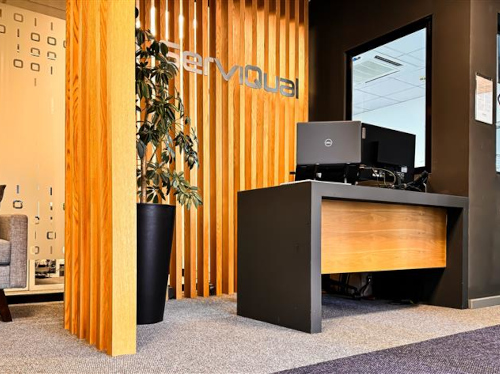 A desk with a computer in an IT office.